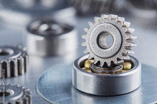 metal gears and bearings. Background with part of the mechanism.