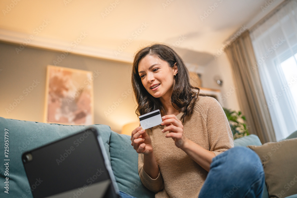woman use credit car shopping online payment or reservation at home woman use credit car shopping online payment or reservation at home
