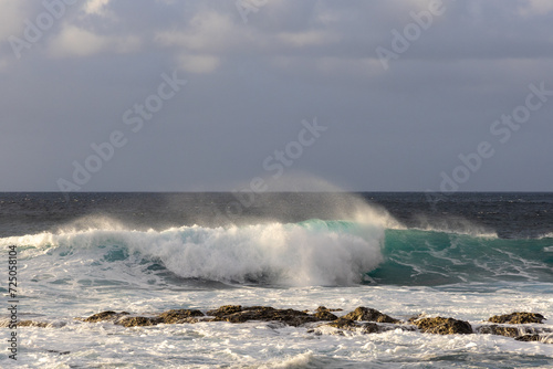 Waves rolling in over volcanic rock in Puert de las Nieves, Gran Canaria, Spain