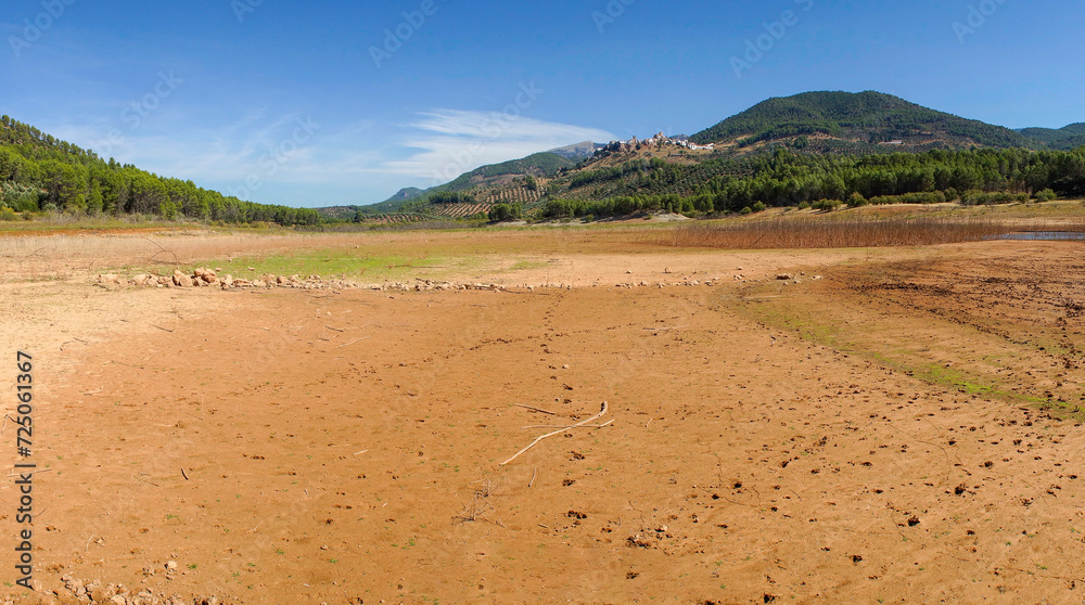 Depleted Tranco Reservoir with Hornos de Segura Village in View Depleted Tranco Reservoir with Hornos de Segura Village in View