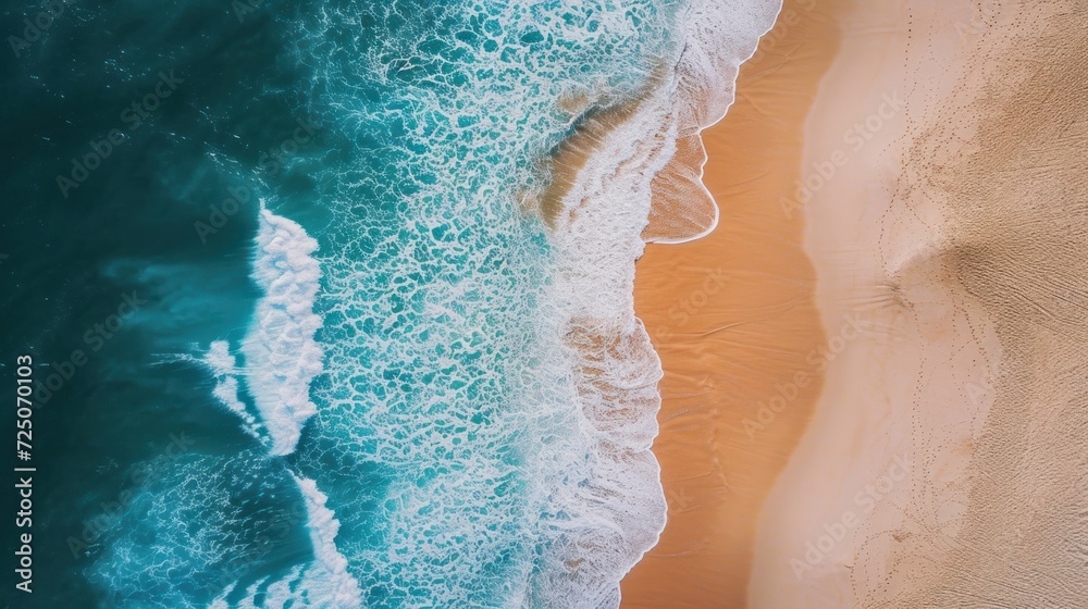  a bird's eye view of a sandy beach and a body of water with waves coming in from the sand.