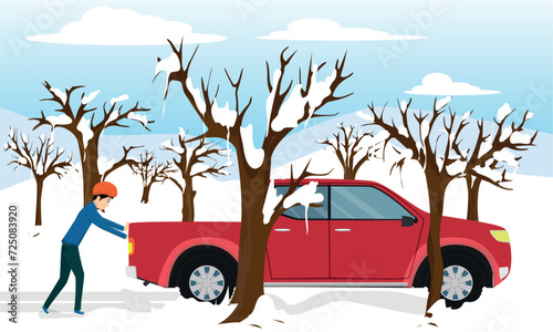 The young man whose car was stuck in the snow is pushing his car