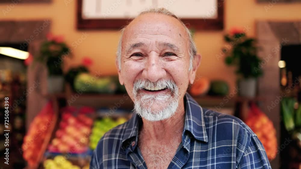 Latin senior man shopping at farm market. Customer buying at grocery store. Small business concept Latin senior man shopping at farm market. Customer buying at grocery store. Small business concept