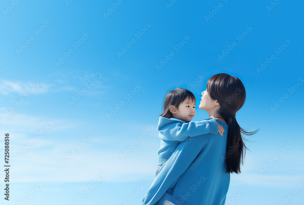 close up photo of mother and daughter. blue sky with white clouds. close up photo of mother and daughter. blue sky with white clouds.