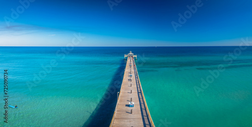 panoramic drone view of pier over ocean