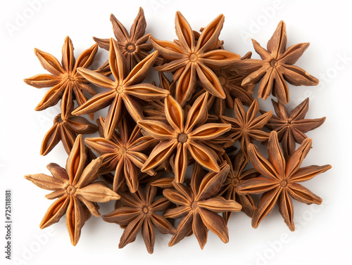 Heap of dried stars anise close up isolated on white background