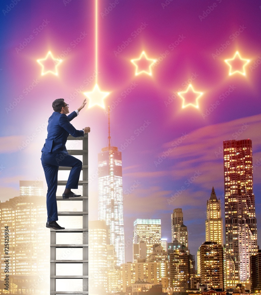 Businessman reaching out for stars