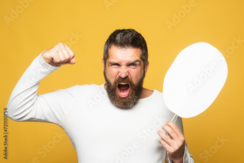 Man with angry expression. Angry hateful guy furious. Angry rage man face. Anger man with furious negative emotion portrait. Aggressive and mad bearded man bad behavior in studio.