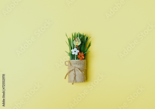 One beautiful flower martisor on sprouted wheat in a pot.
