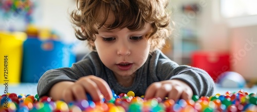 Sensory play at home for children includes activities like Montessori games, aiding sensory processing disorder, child development, and occupational therapy. photo