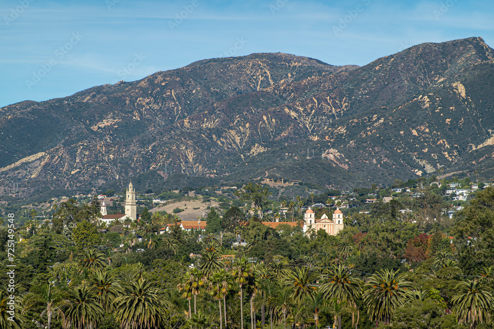 Obraz premium Santa Barbara, CA, USA - November 30, 2023: Santa Barbara County Courthouse lookout tower view on Old Mission double tower and Saint Anthony Seminary tower. Santa Ynez mountains