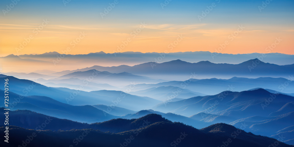 Peaceful Morning: Majestic Mountain Range Awash in Vibrant Colors of Sunrise