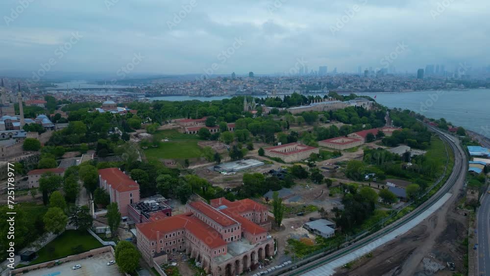Flying over Topkapi Palace with Golden Horn and Beyoglu district at the background in historic city of Istanbul, Turkey. Historic Istanbul is a World Heritage Site.