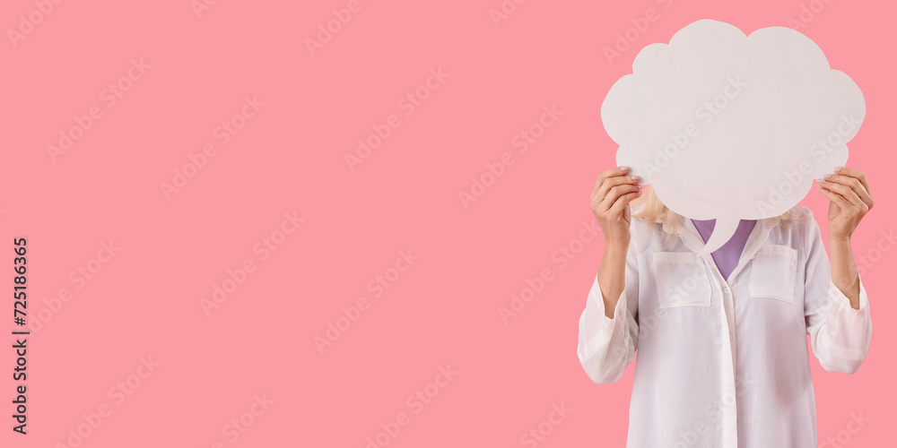 Woman holding blank speech bubble on pink background with space for text