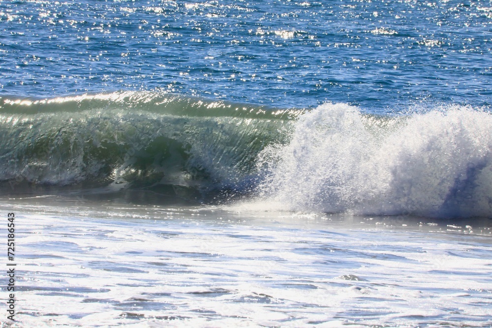 Large wave splashing in blue sea Large wave splashing in blue sea