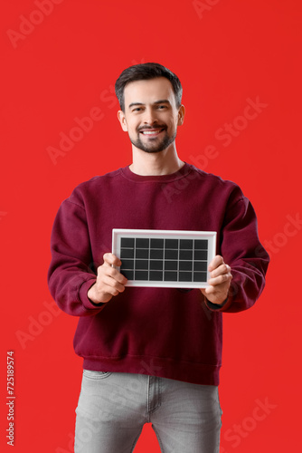 Handsome man with portable ...