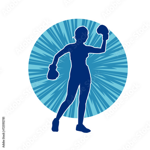 Silhouette of woman boxing athlete in action pose. Silhouette of a female wearing boxing gloves for boxing sport.
