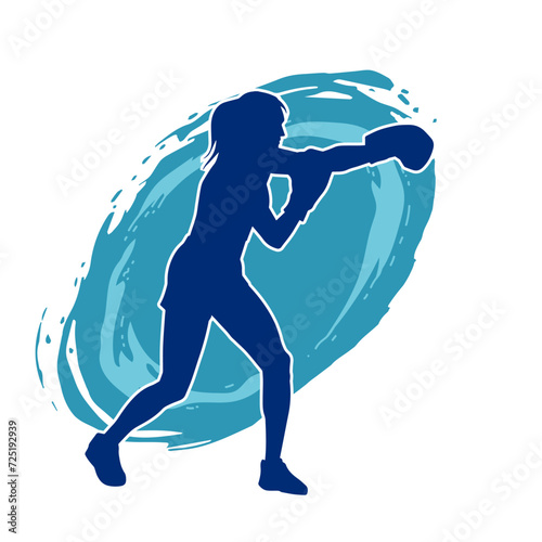 Silhouette of woman boxing athlete in action pose. Silhouette of a female wearing boxing gloves for boxing sport.