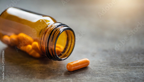 empty medication bottle with just two remaining capsules, evoking the fragility of health and the passage of time