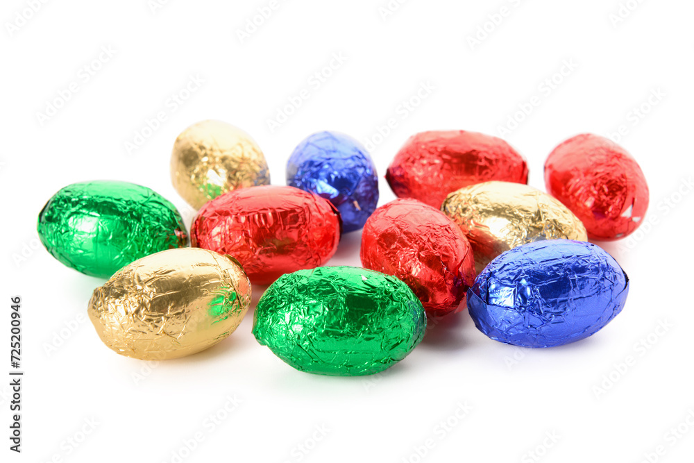 Chocolate Easter eggs in colorful foil isolated on white background Chocolate Easter eggs in colorful foil isolated on white background