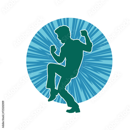 Silhouette of a slim man dancing pose. Silhouette of a male dancer in action pose.