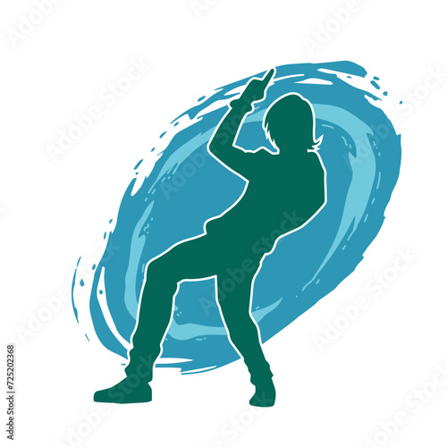 Silhouette of a slim man dancing pose. Silhouette of a male dancer in action pose.