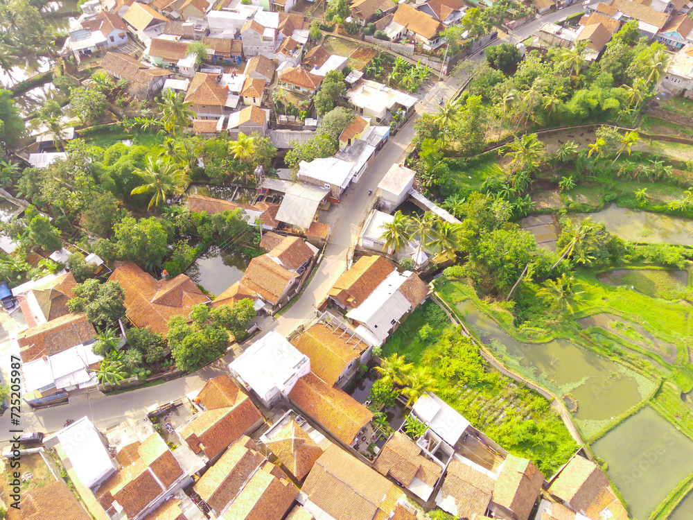 Top view of Dense Housing. Aerial Photography. Aerial panorama over the dense housing complex. Shot from a drone flying 200 meters high. Cikancung, Indonesia