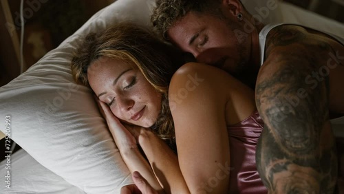 A loving couple sleeps peacefully in a cozy bedroom, evoking intimacy and comfort.