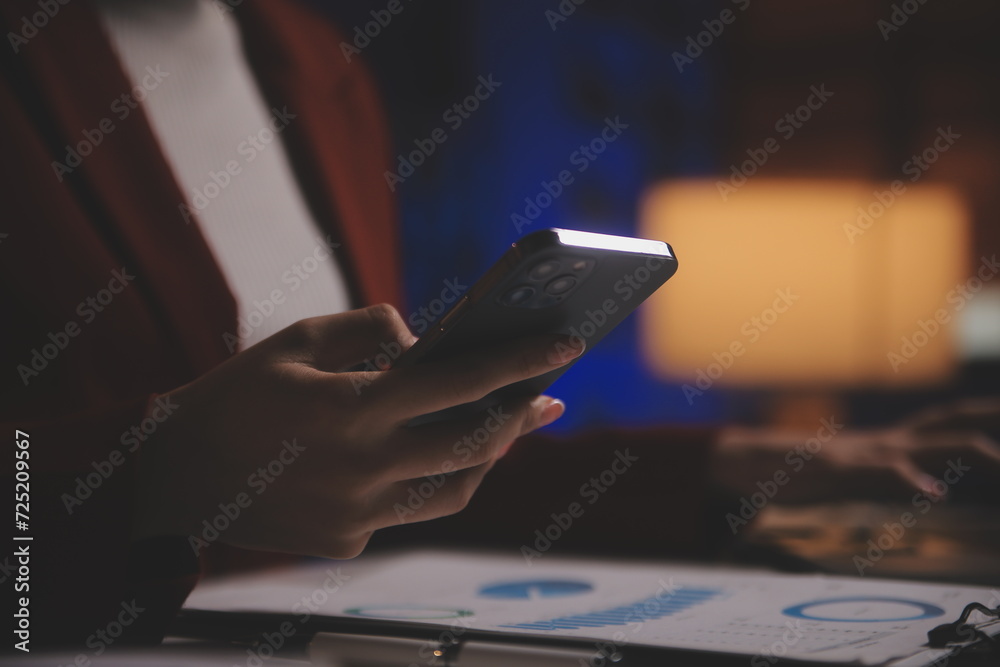 Fototapeta premium Business woman using calculator for do math finance on wooden desk in office and business working background, tax, accounting, statistics and analytic research concept