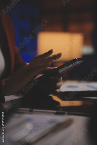 Business woman using calculator for do math finance on wooden desk in office and business working background, tax, accounting, statistics and analytic research concept © Phanphen