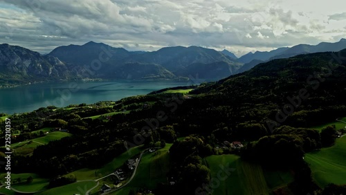 Wallpaper Mural Large clear blue lake between the Austrian Alps on a sunny day. Aerial panning view Torontodigital.ca