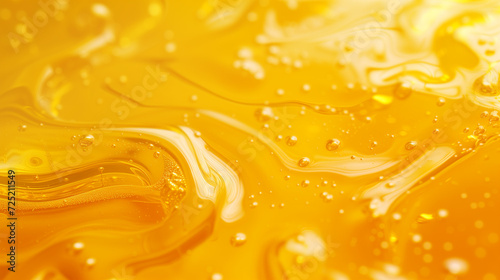 Close-up texture of golden honey with bubbles, illustrating the concept of organic natural sweeteners or food ingredients