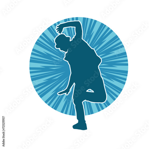 Silhouette of a man in dancing pose. Silhouette of a male dancer in performing pose.