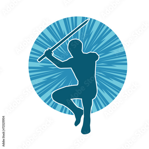 Silhouette of a male warrior in action pose with sword weapon. Silhouette of a man fighter carrying sword weapon.