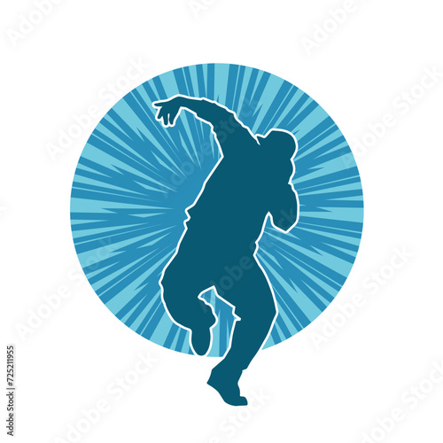 Silhouette of a man in dancing pose. Silhouette of a male dancer in performing pose.