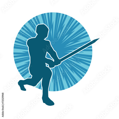 Silhouette of a male warrior in action pose with sword weapon. Silhouette of a man fighter carrying sword weapon.