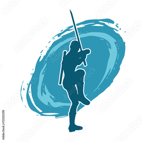 Silhouette of a male warrior in action pose with sword weapon. Silhouette of a man fighter carrying sword weapon.