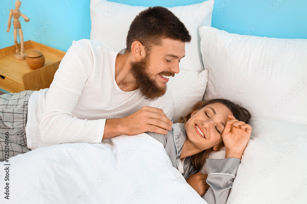 Fototapeta premium Happy couple in love in bedroom