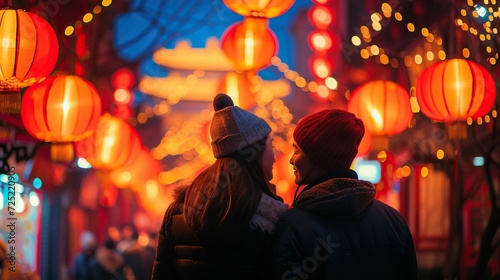 A couple enjoying Chinese New Year's Eve filled with beautiful lanterns in the sky, imlek new year's