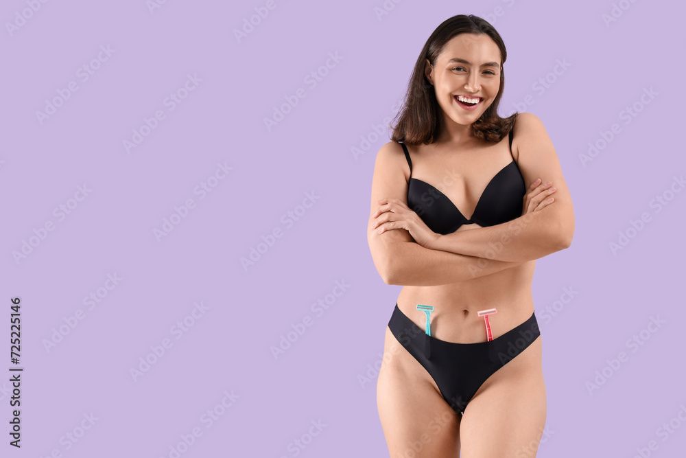 Obraz premium Beautiful young happy woman with razors on purple background