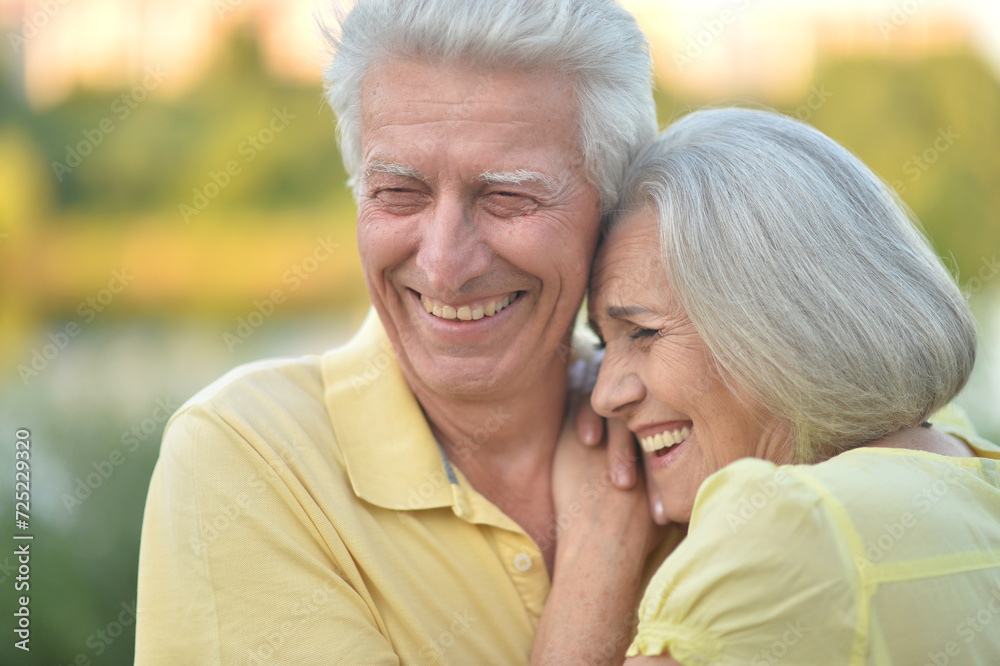 Portrait of beautiful elderly couple together in park Portrait of beautiful elderly couple together in park
