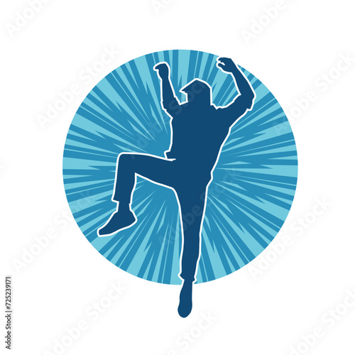 Silhouette of a man in dancing pose. Silhouette of a male dancer in performing pose.
