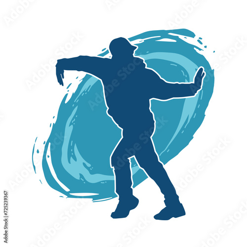 Silhouette of a man in dancing pose. Silhouette of a male dancer in performing pose.