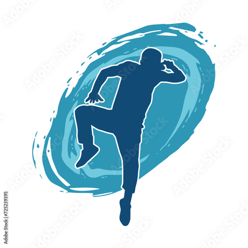 Silhouette of a man in dancing pose. Silhouette of a male dancer in performing pose.