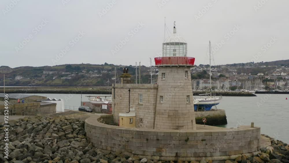 Howth lighthouse, Dublin. Aerial pulling back in a very slow motion Howth lighthouse, Dublin. Aerial pulling back in a very slow motion
