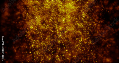 Blurred yellow abstract background of bokeh and small round particles of energy magical holiday flying dots on a black background