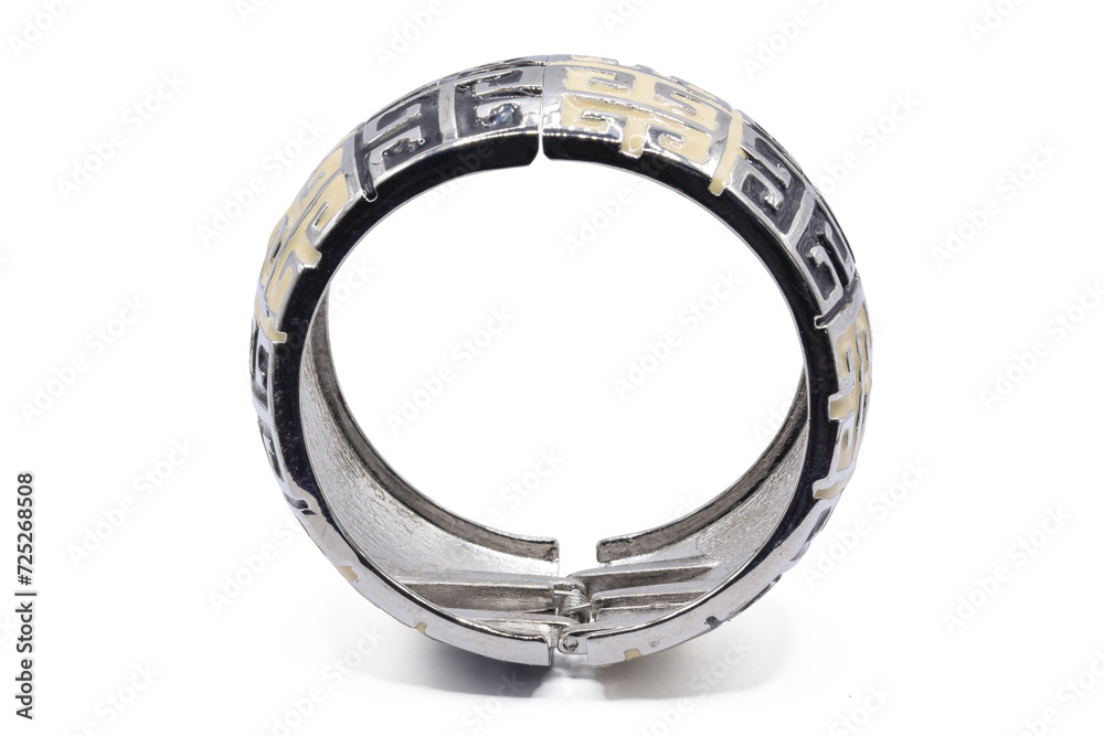 old bangle bracelet made from shiny metal  isolated on  white background,macro photo,has path