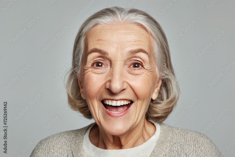 Portrait of senior female smiling woman looking at camera laughing Portrait of senior female smiling woman looking at camera laughing