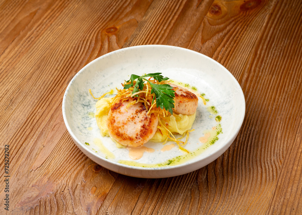 Fish cutlets with mashed potatoes on wooden background Fish cutlets with mashed potatoes on wooden background