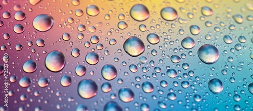 Gray Toned water droplets on a colored background.